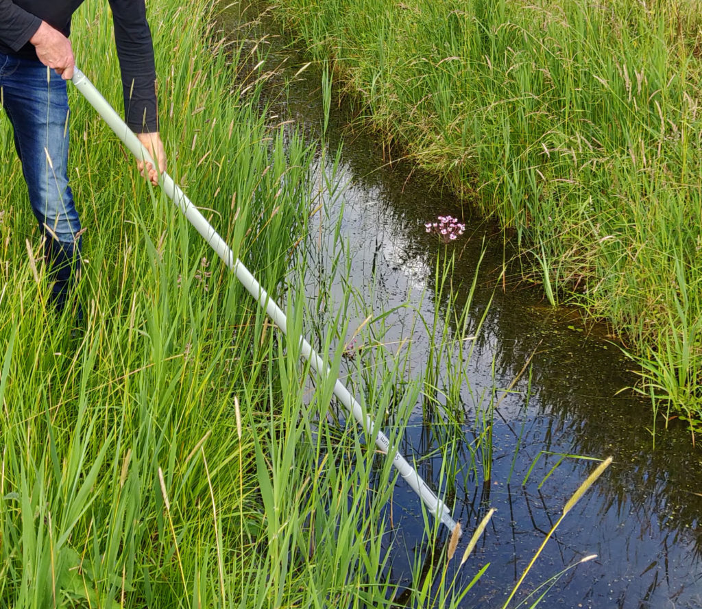 Sampling rod holding sterile syringe